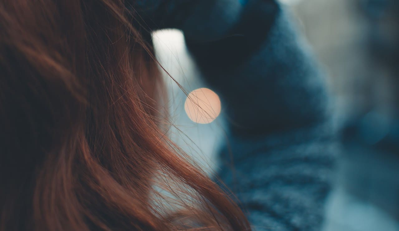 Vivid red colour on long hair, styled at Orange Eleven, Cape Town