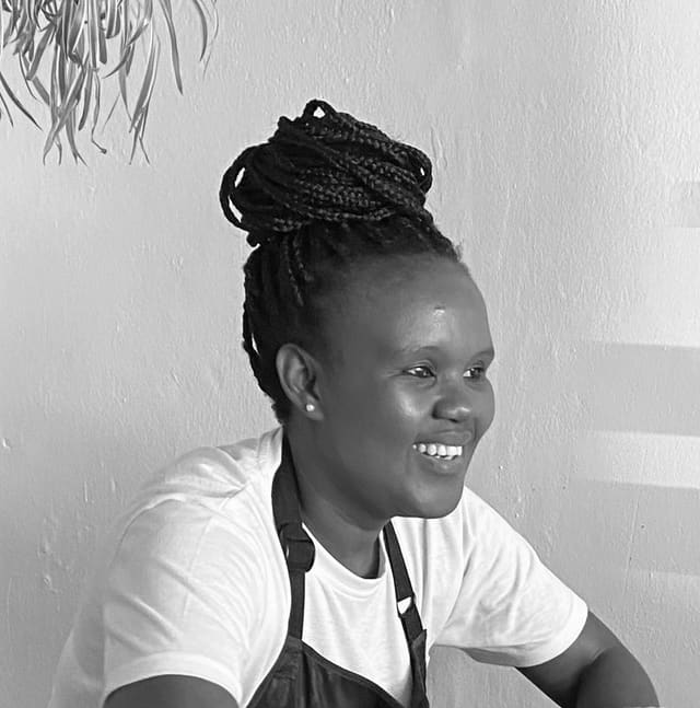 Kusi, salon operator at Orange Eleven, black-and-white portrait