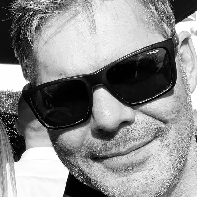 Michael, co-owner of Orange Eleven, black-and-white portrait