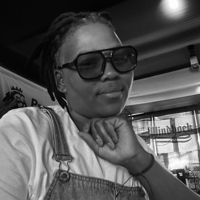 Unathi, salon operator at Orange Eleven, black-and-white portrait